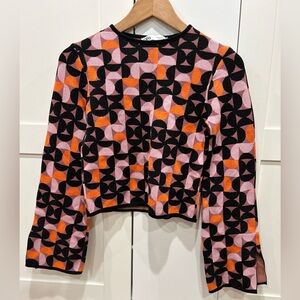 Cropped, bell split sleeved sweater